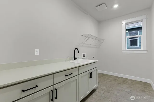 a bathroom with a sink and vanity