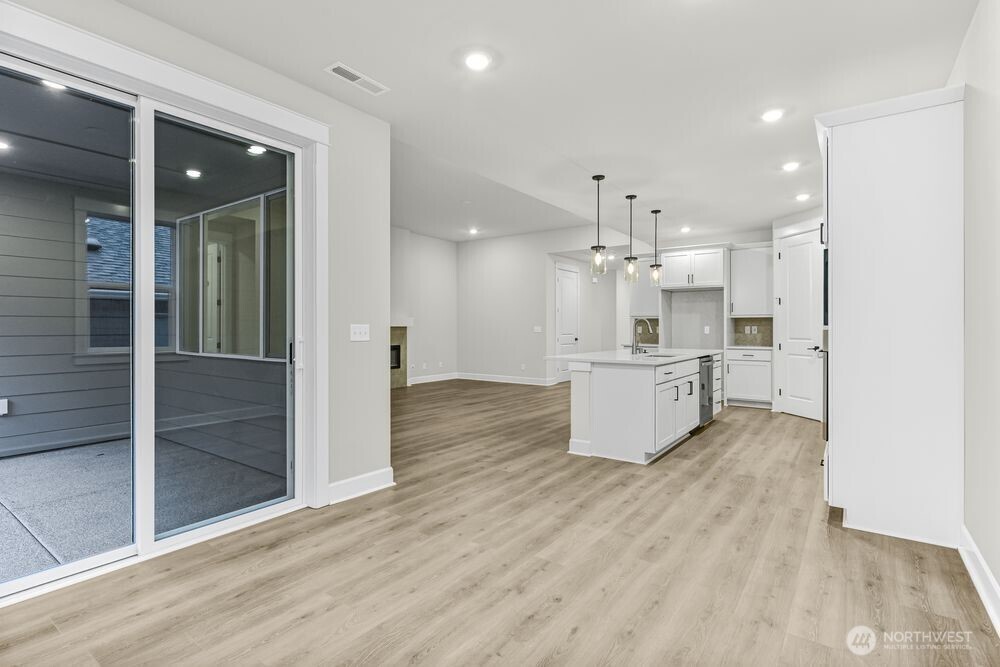 2538 Acer Loop Southeast Lacey, WA 98513 - Photo 8 of 13 a large kitchen with a sink stainless steel appliances and window
