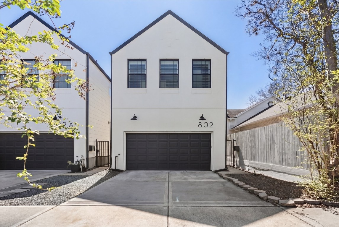 a front view of a house with garage