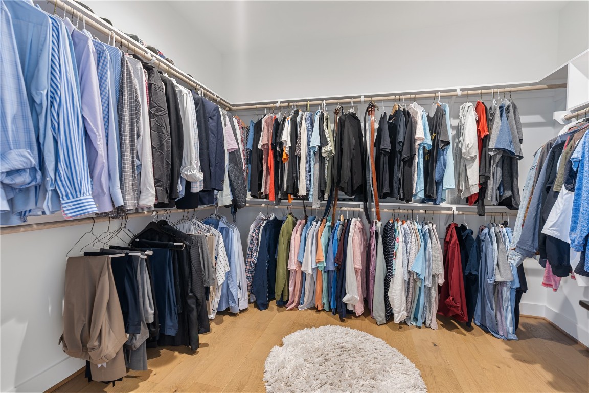 802 Aurora Street Houston, TX 77009 - Photo 15 of 23 a view of walk in closet with clothes