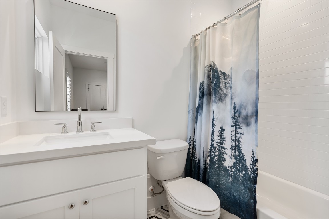802 Aurora Street Houston, TX 77009 - Photo 17 of 23 a bathroom with a sink a toilet and shower