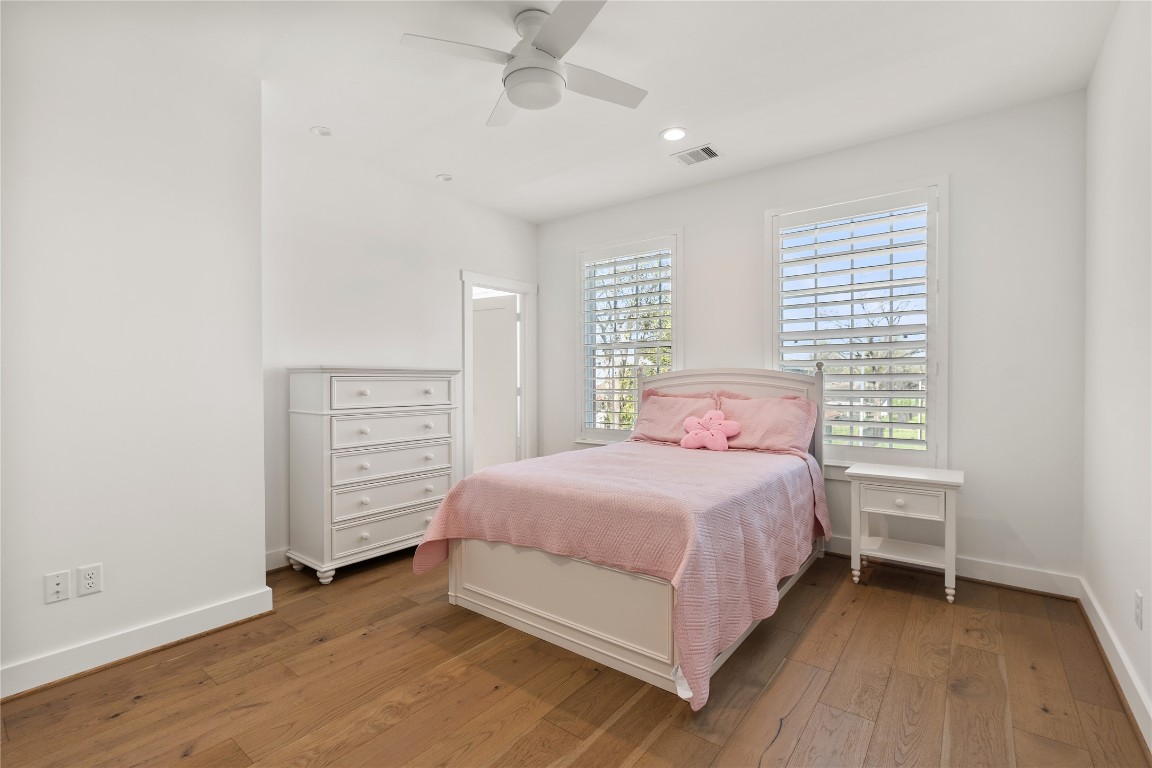 802 Aurora Street Houston, TX 77009 - Photo 18 of 23 a bedroom with a bed and a window