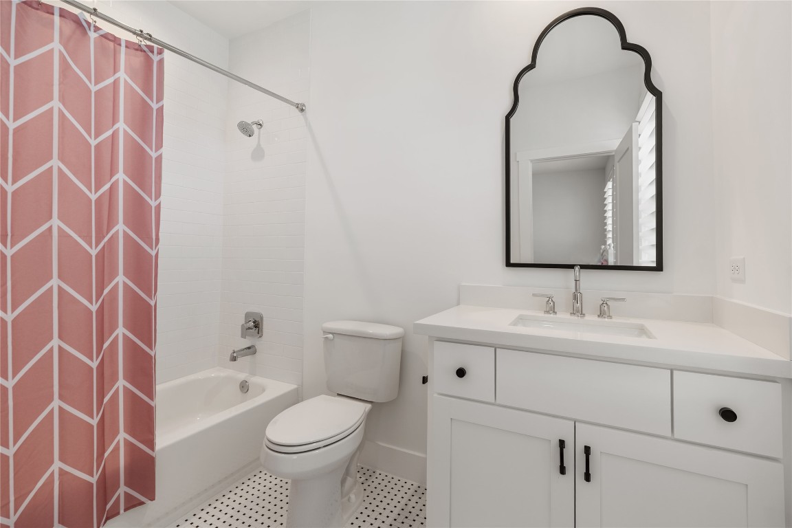 802 Aurora Street Houston, TX 77009 - Photo 19 of 23 a bathroom with a sink toilet and shower