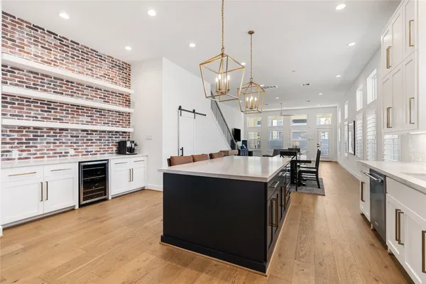 a kitchen with granite countertop a sink and a stove top oven