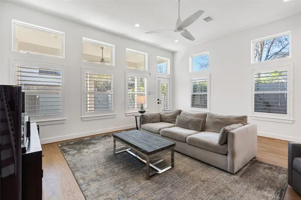 a living room with furniture and windows