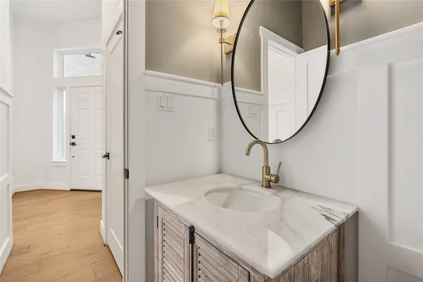 a bathroom with a sink a mirror and a shower