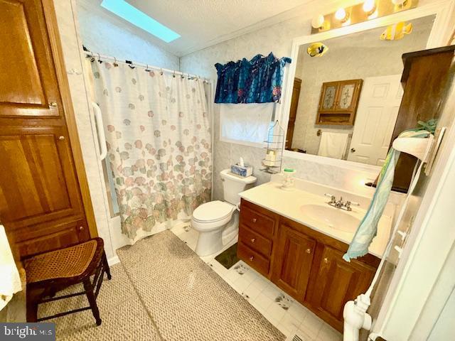 216 Timberline Circle Berlin, MD 21811 - Photo 20 of 31 a bathroom with a sink a toilet and shower curtain