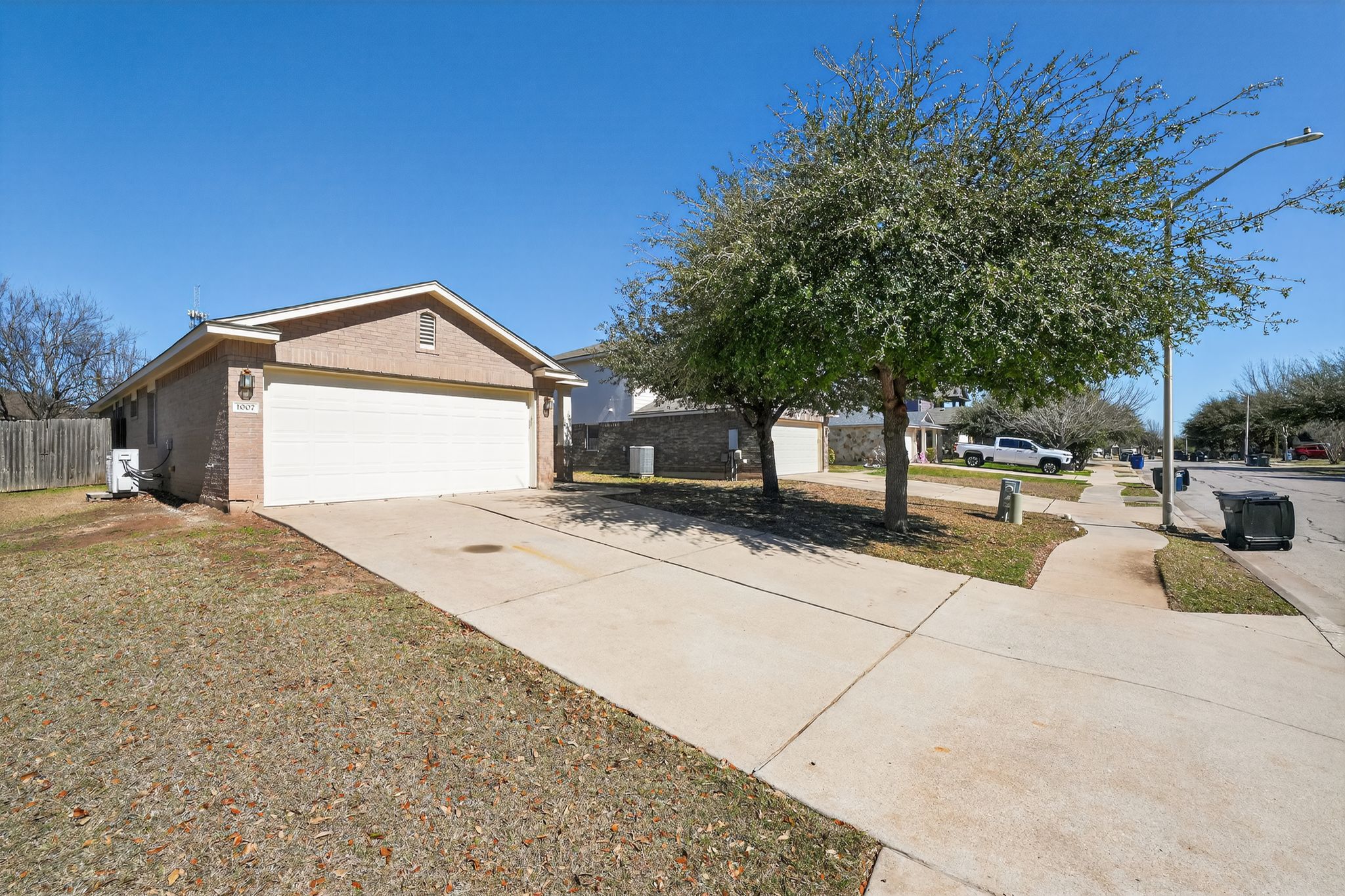 1007 Gentry Drive Leander, TX 78641 - Photo 3 of 35 a front view of a house with a yard