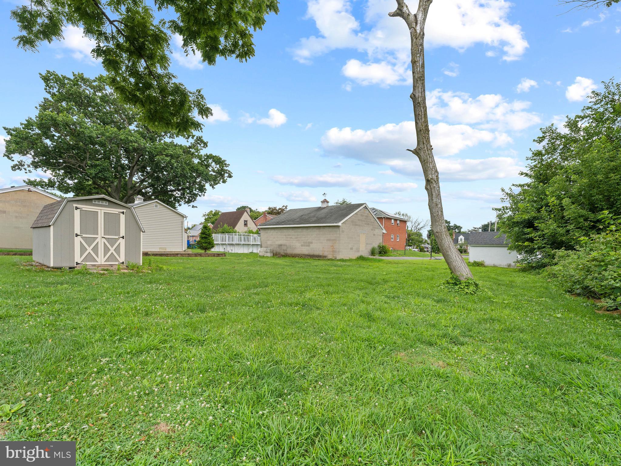 209 Upland Road Brookhaven, PA 19015 - Photo 31 of 39 a view of a house with a backyard and a tree