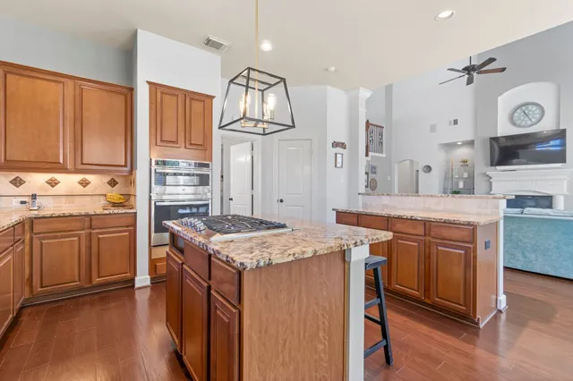 a kitchen that has a lot of cabinets in it