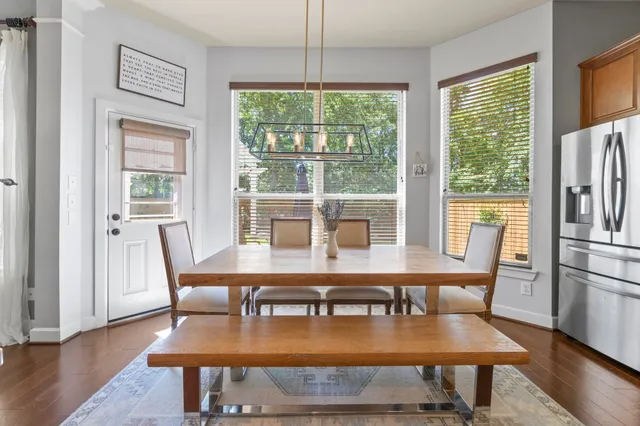 a view of a dining room with furniture window and wooden floor