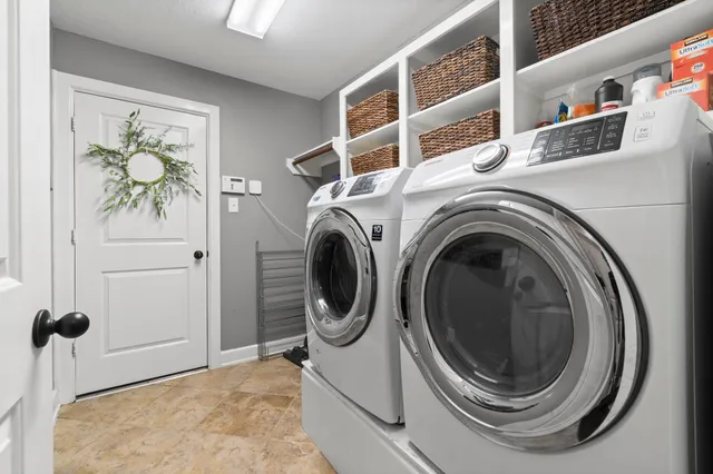 a utility room with dryer and washer
