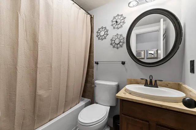 a bathroom with a toilet and a sink