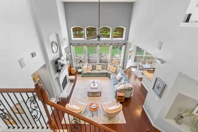 a view of a living room with furniture and a large window