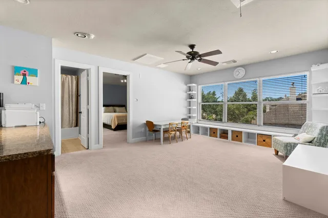 a view of a livingroom with furniture and a flat screen tv