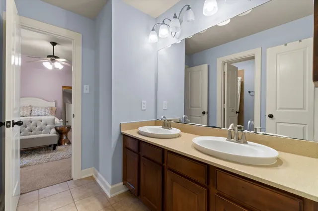 a en suite bathroom with a sink and a mirror