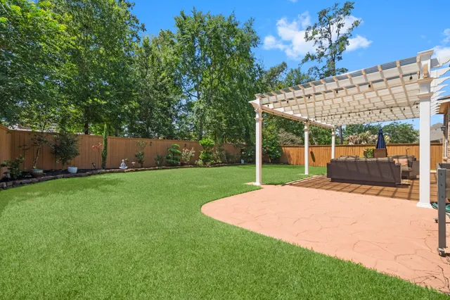 a view of a backyard with a garden and plants
