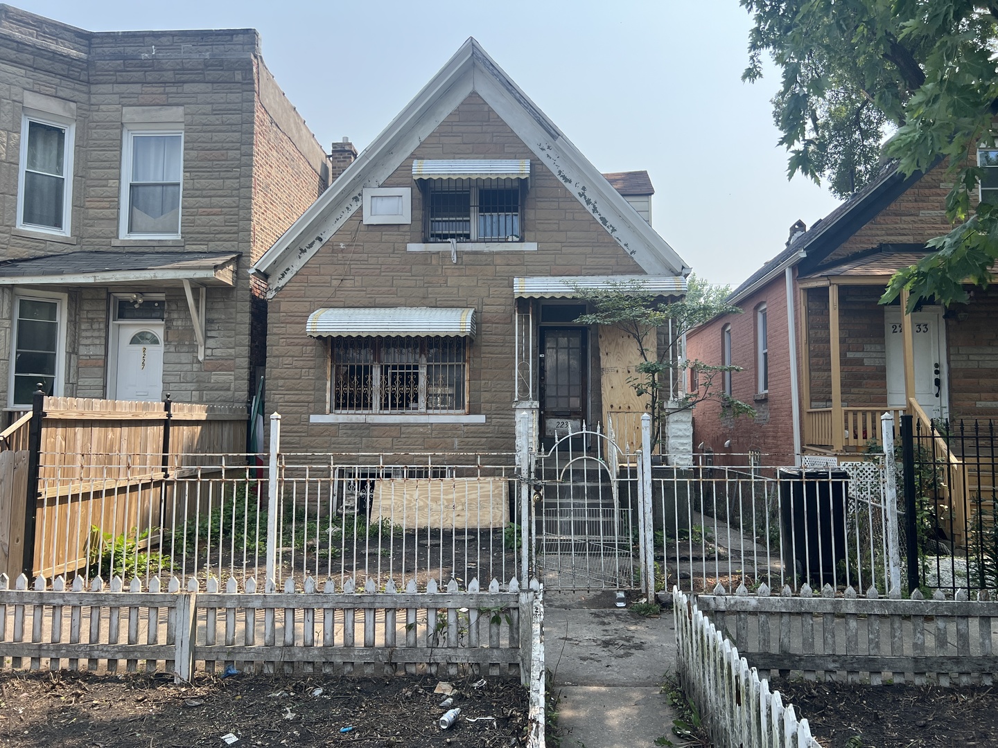 2231 South Drake Avenue Chicago, IL 60623 - Photo 1 of 16 a front view of a house with iron fence