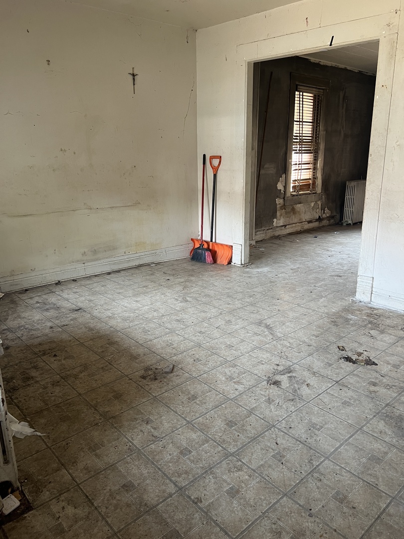 2231 South Drake Avenue Chicago, IL 60623 - Photo 3 of 16 a view of empty room with fireplace