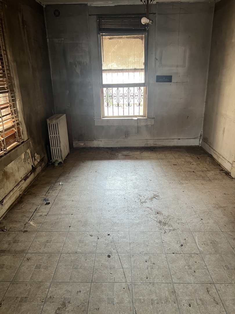 2231 South Drake Avenue Chicago, IL 60623 - Photo 4 of 16 an empty room with windows