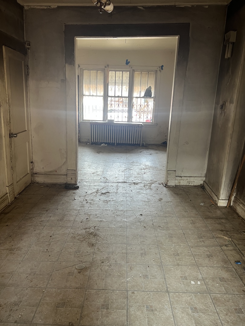 2231 South Drake Avenue Chicago, IL 60623 - Photo 7 of 16 a view of an empty room with a window