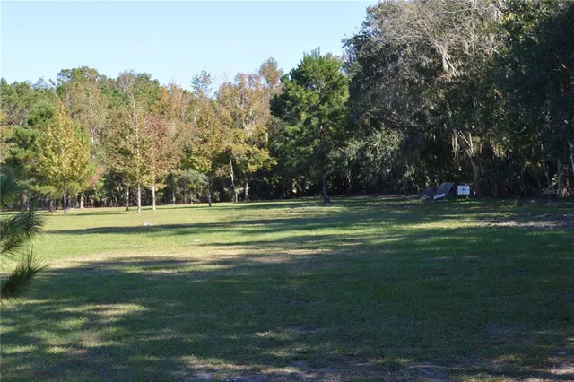 a view of a lake with a house in the background