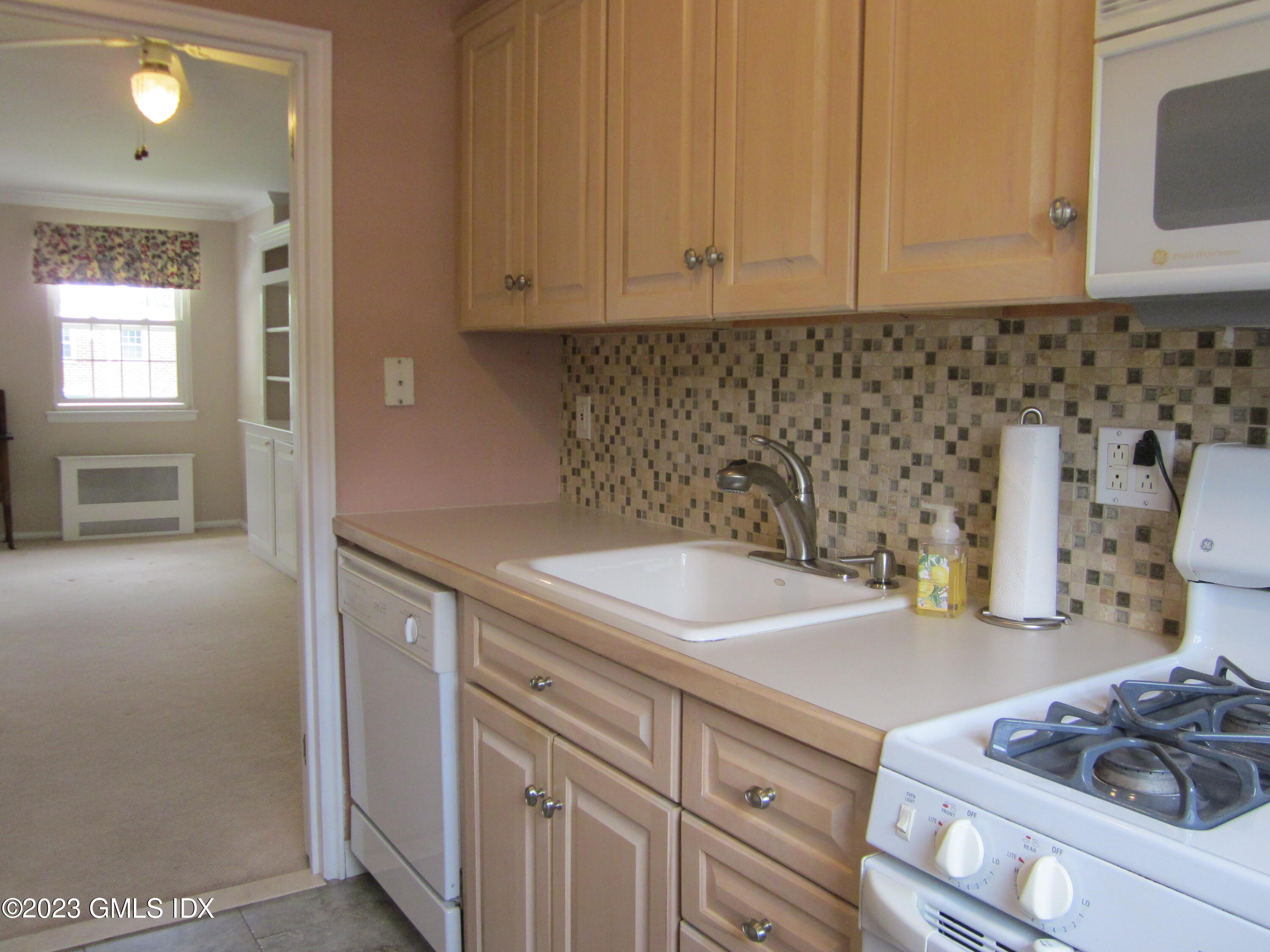 68 Putnam Park, Unit 68 Greenwich, CT 06830 - Photo 11 of 31 a kitchen with sink and cabinets