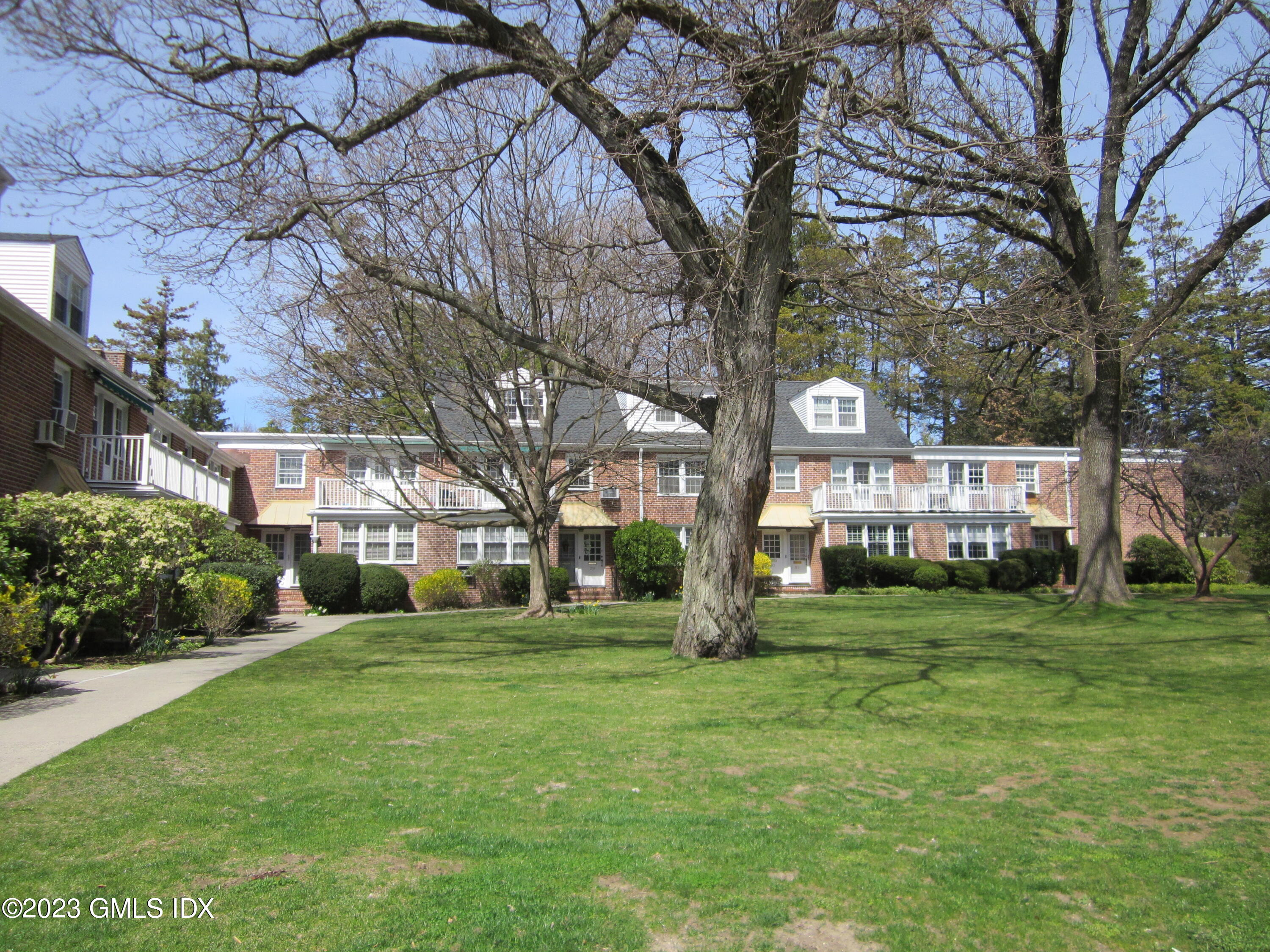 68 Putnam Park, Unit 68 Greenwich, CT 06830 - Photo 24 of 31 a view of a trees in front of a building