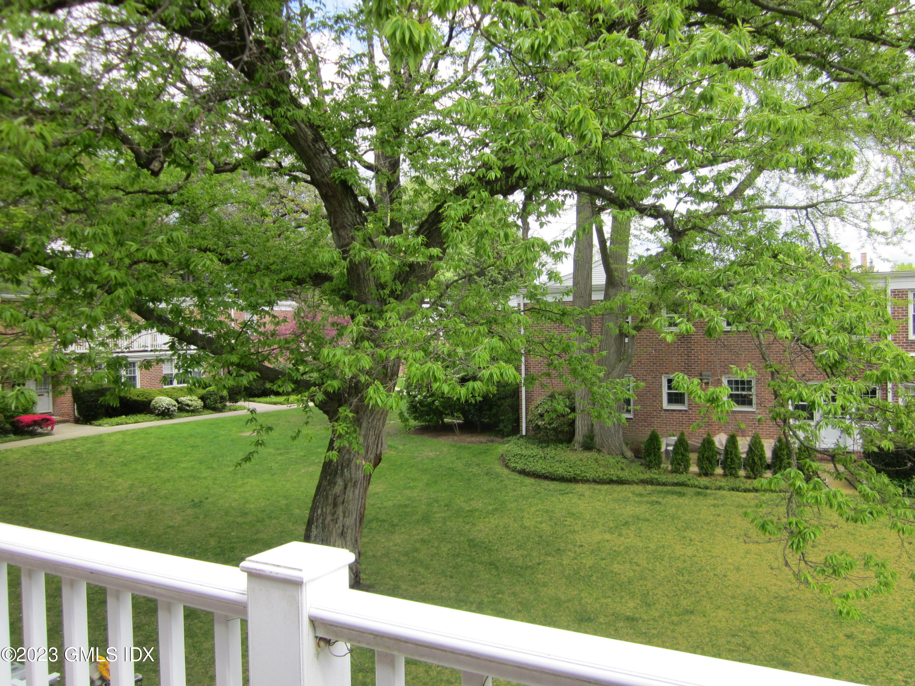 68 Putnam Park, Unit 68 Greenwich, CT 06830 - Photo 6 of 31 a view of a park with large trees