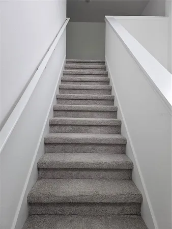 a view of an empty room and closet area