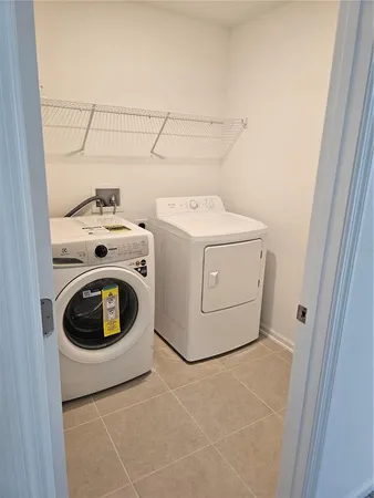 an empty room with closet and mirror