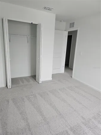 an empty room with a empty space and window
