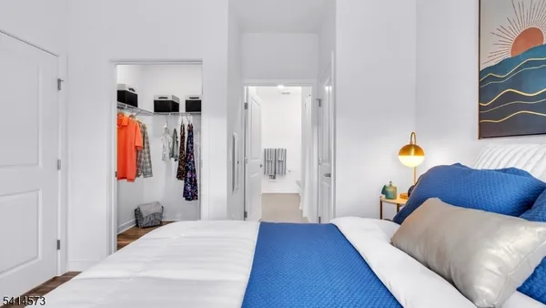 a bedroom with a bed and a couch