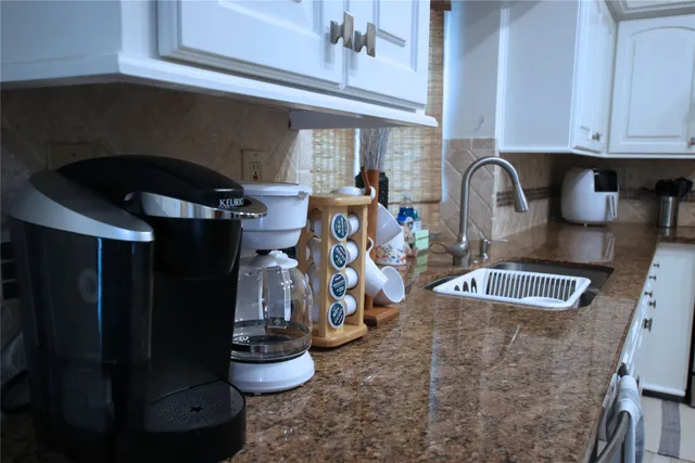 a kitchen with a stove and cabinets