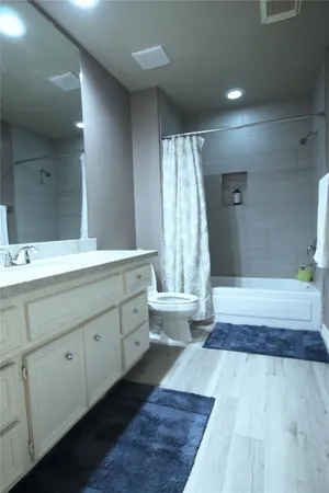 a bathroom with a tub and sink