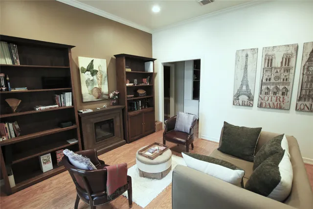 a living room with furniture cabinets and a flat screen tv