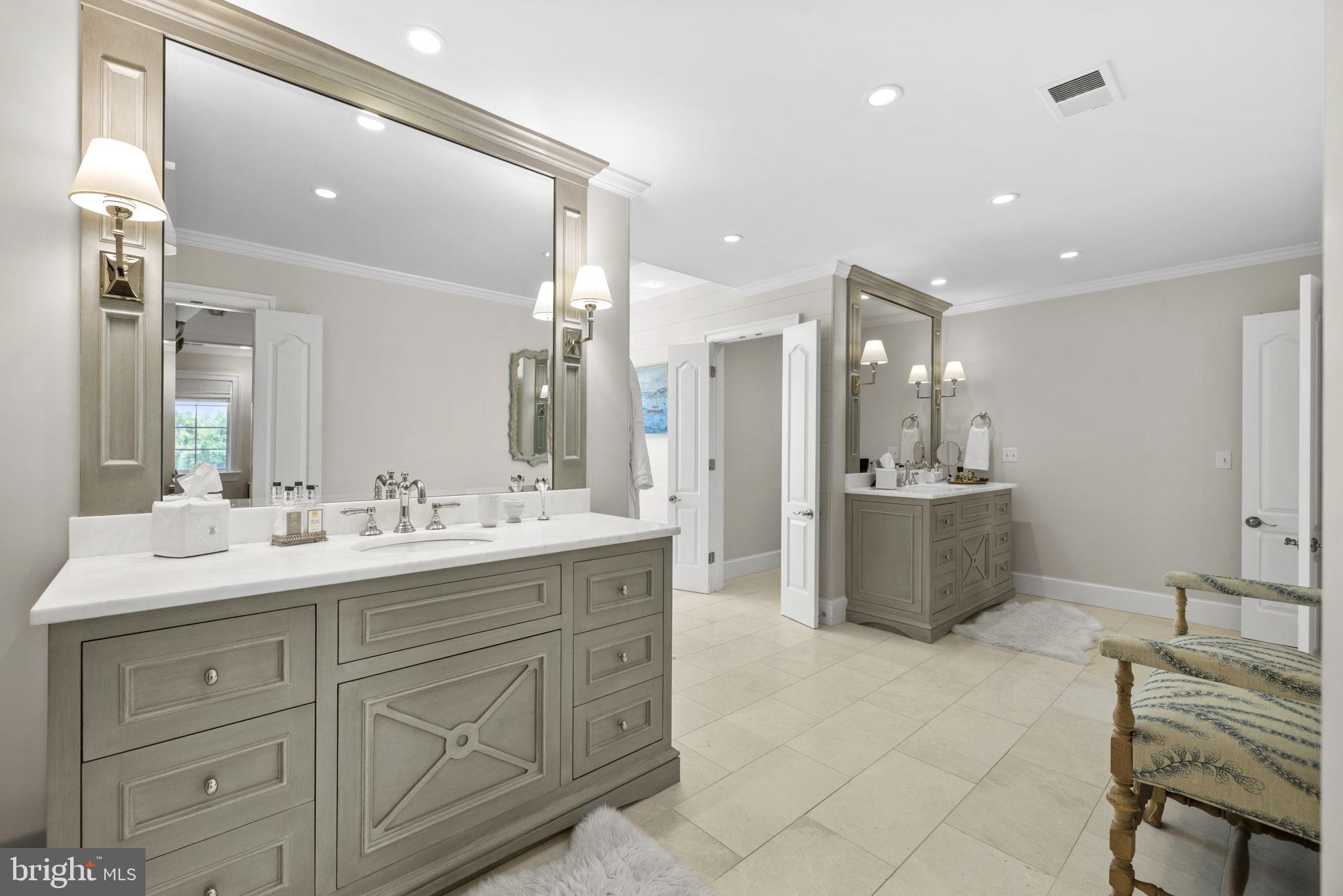 36190 Turkey Roost Road Middleburg, VA 20117 - Photo 41 of 88 a bathroom with a tub a sink double vanity and a mirror