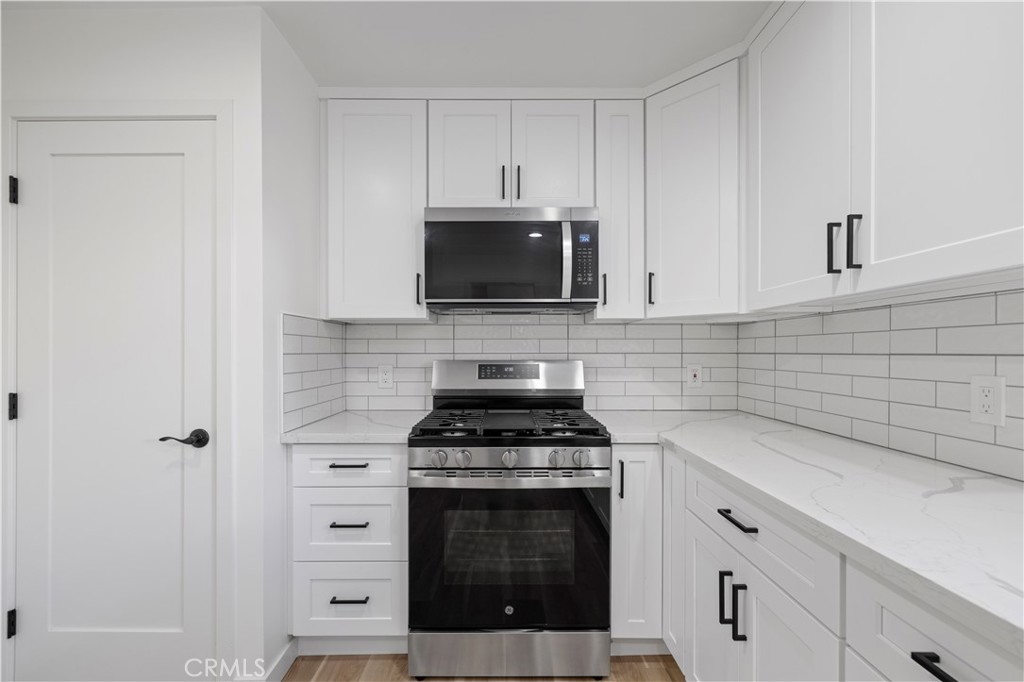 7049 Sunnycrest Trail Tujunga, CA 91042 - Photo 11 of 39 a kitchen with stainless steel appliances a stove and a microwave