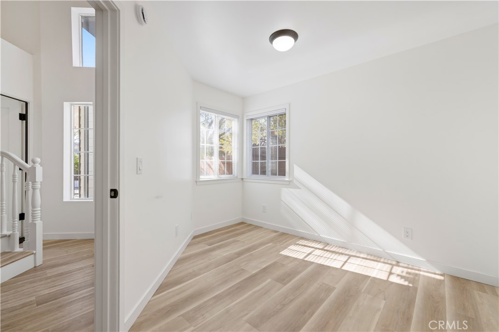 7049 Sunnycrest Trail Tujunga, CA 91042 - Photo 12 of 39 a view of empty room with wooden floor and fan