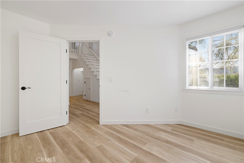 7049 Sunnycrest Trail Tujunga, CA 91042 - Photo 13 of 39 a view of a room with wooden floor and windows