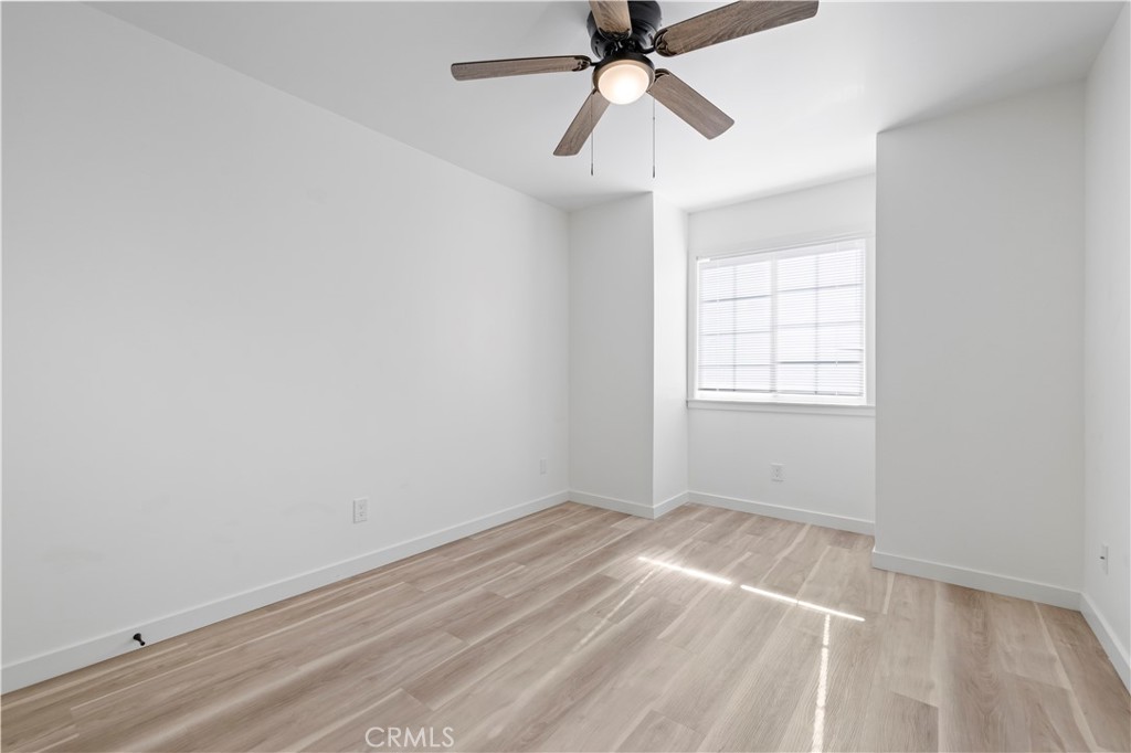 7049 Sunnycrest Trail Tujunga, CA 91042 - Photo 18 of 39 an empty room with windows and fan