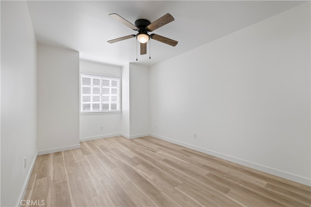 7049 Sunnycrest Trail Tujunga, CA 91042 - Photo 22 of 39 wooden floor in an empty room with a window