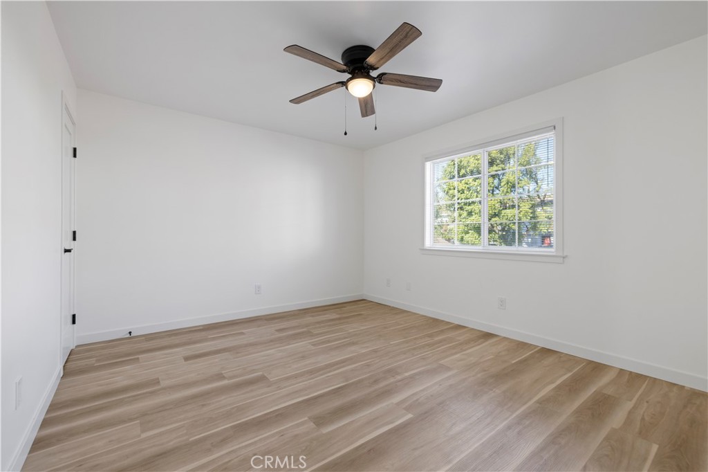 7049 Sunnycrest Trail Tujunga, CA 91042 - Photo 26 of 39 wooden floor in an empty room with a window