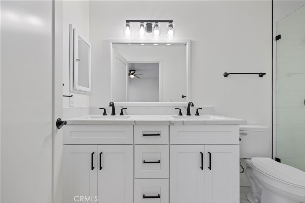 7049 Sunnycrest Trail Tujunga, CA 91042 - Photo 29 of 39 a bathroom with a sink and a toilet
