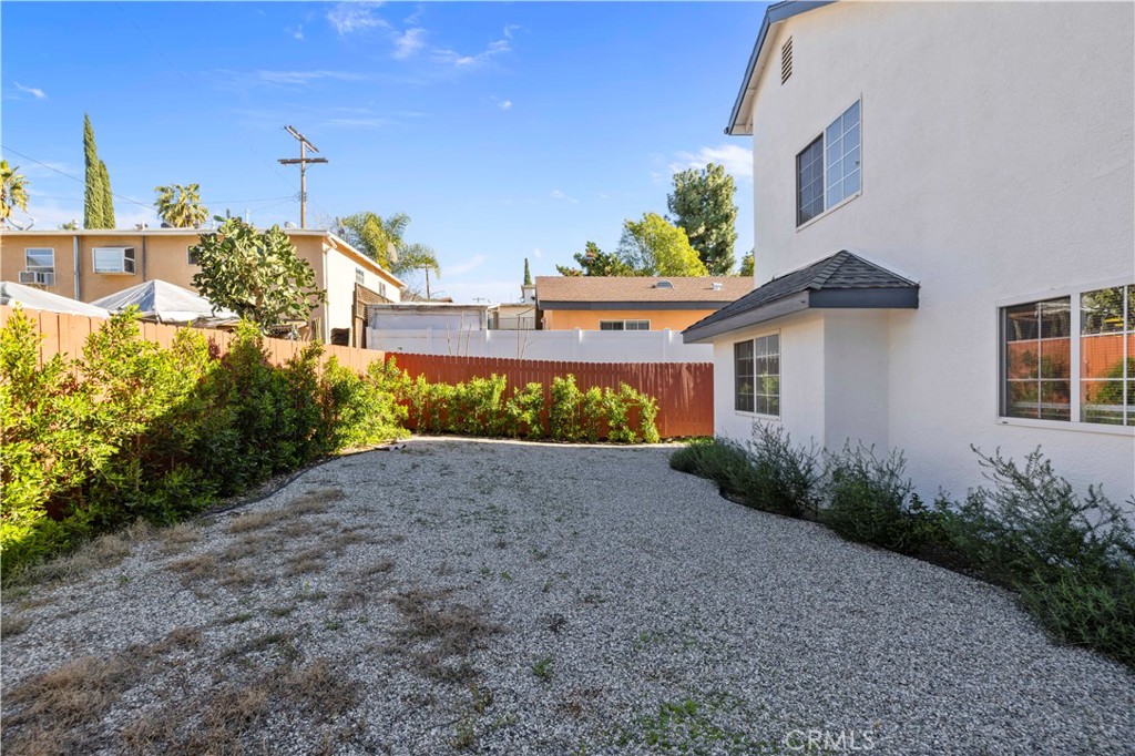7049 Sunnycrest Trail Tujunga, CA 91042 - Photo 32 of 39 a view of a house with a yard and garage