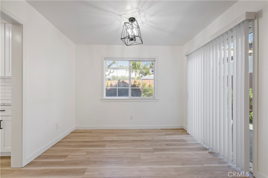 7049 Sunnycrest Trail Tujunga, CA 91042 - Photo 7 of 39 a view of empty room with wooden floor and windows