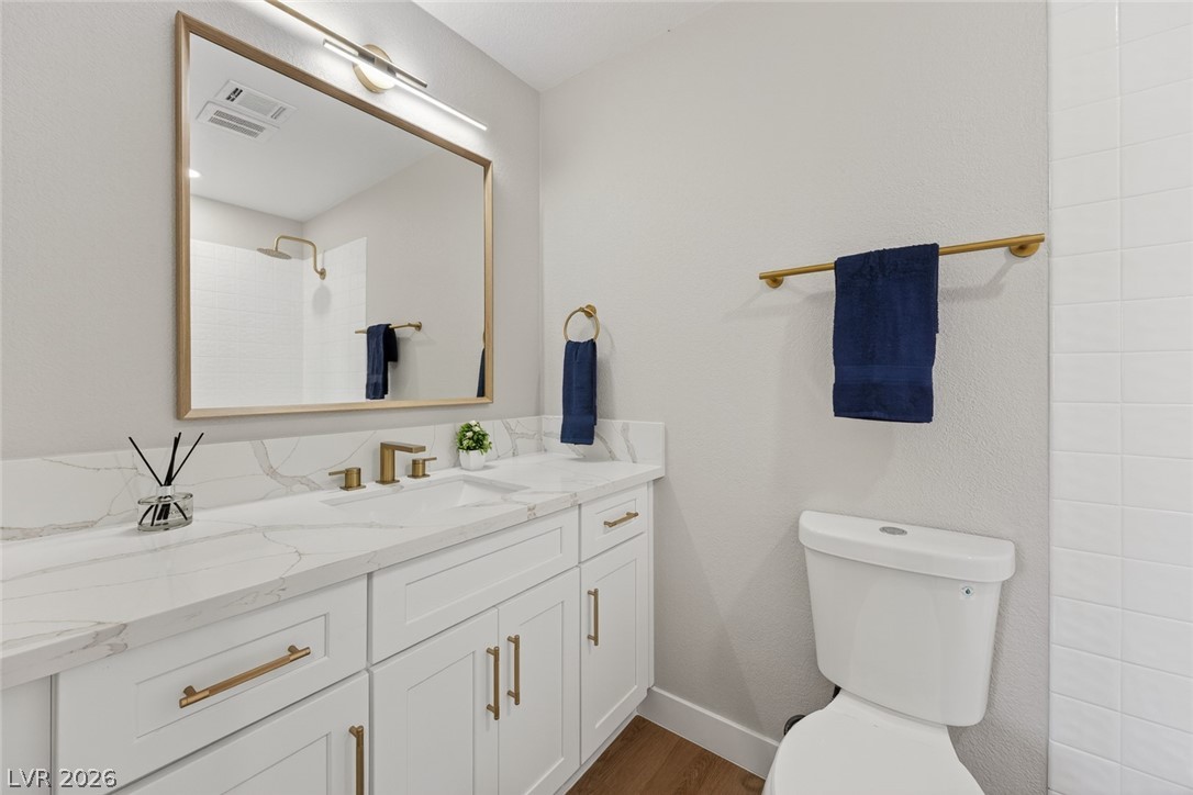 2484 Anglia Street Las Vegas, NV 89142 - Photo 15 of 20 This modern bathroom features clean lines and a functional design for daily rejuvenation.