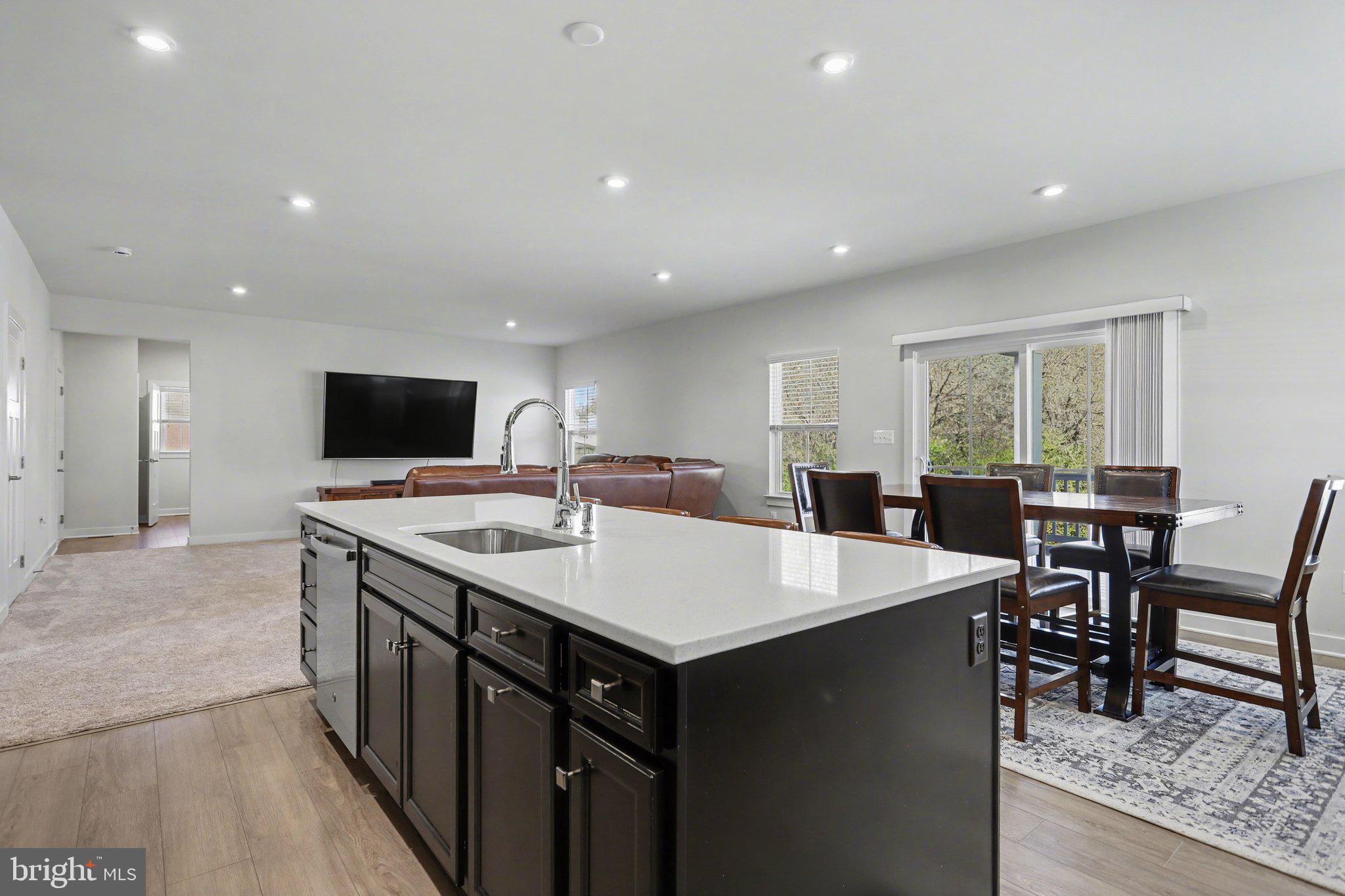220 Kortney Drive Hanover, PA 17331 - Photo 11 of 41 a large kitchen with kitchen island a sink table and chairs