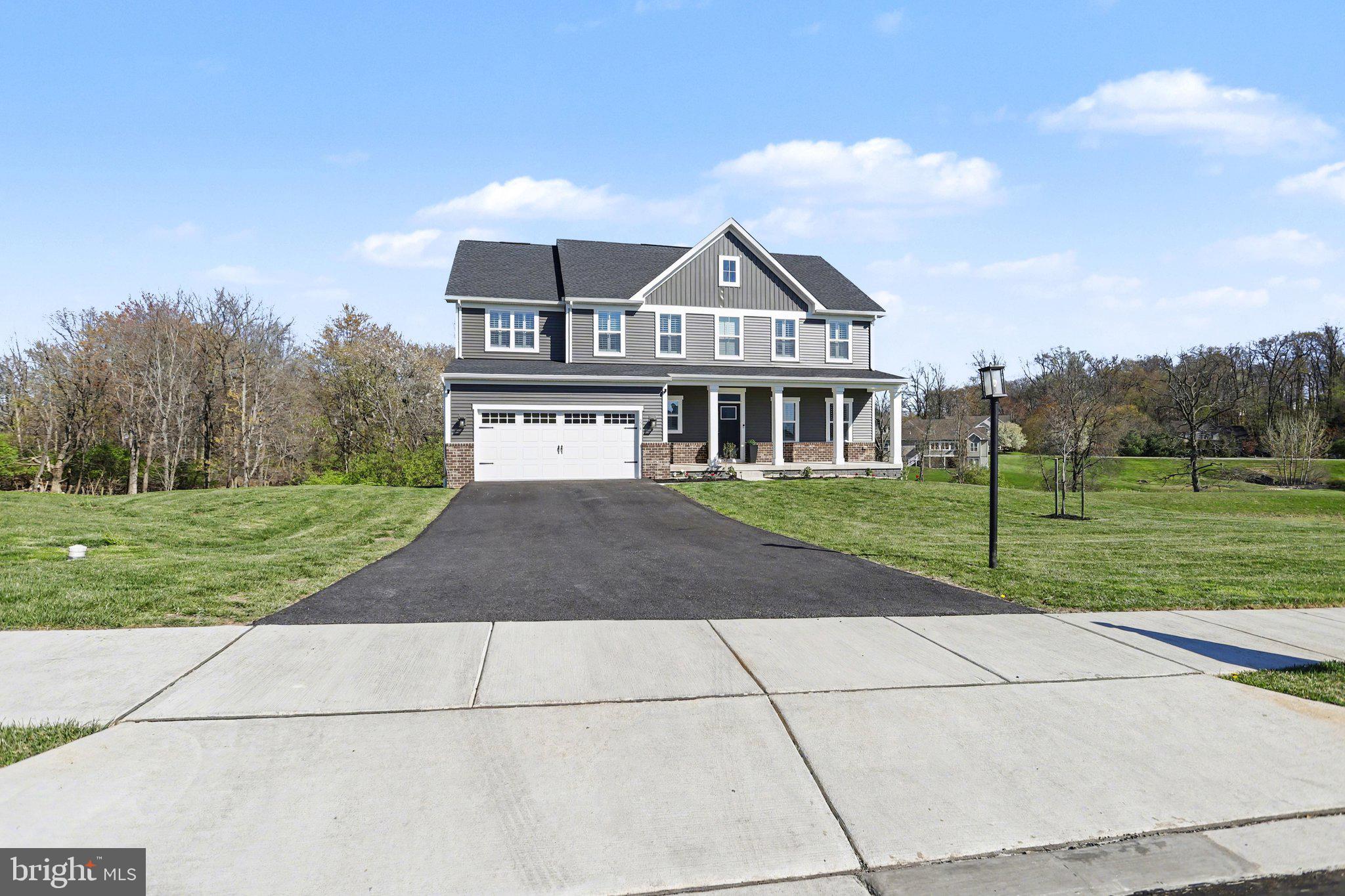 220 Kortney Drive Hanover, PA 17331 - Photo 2 of 41 a view of a house with a big yard and large trees