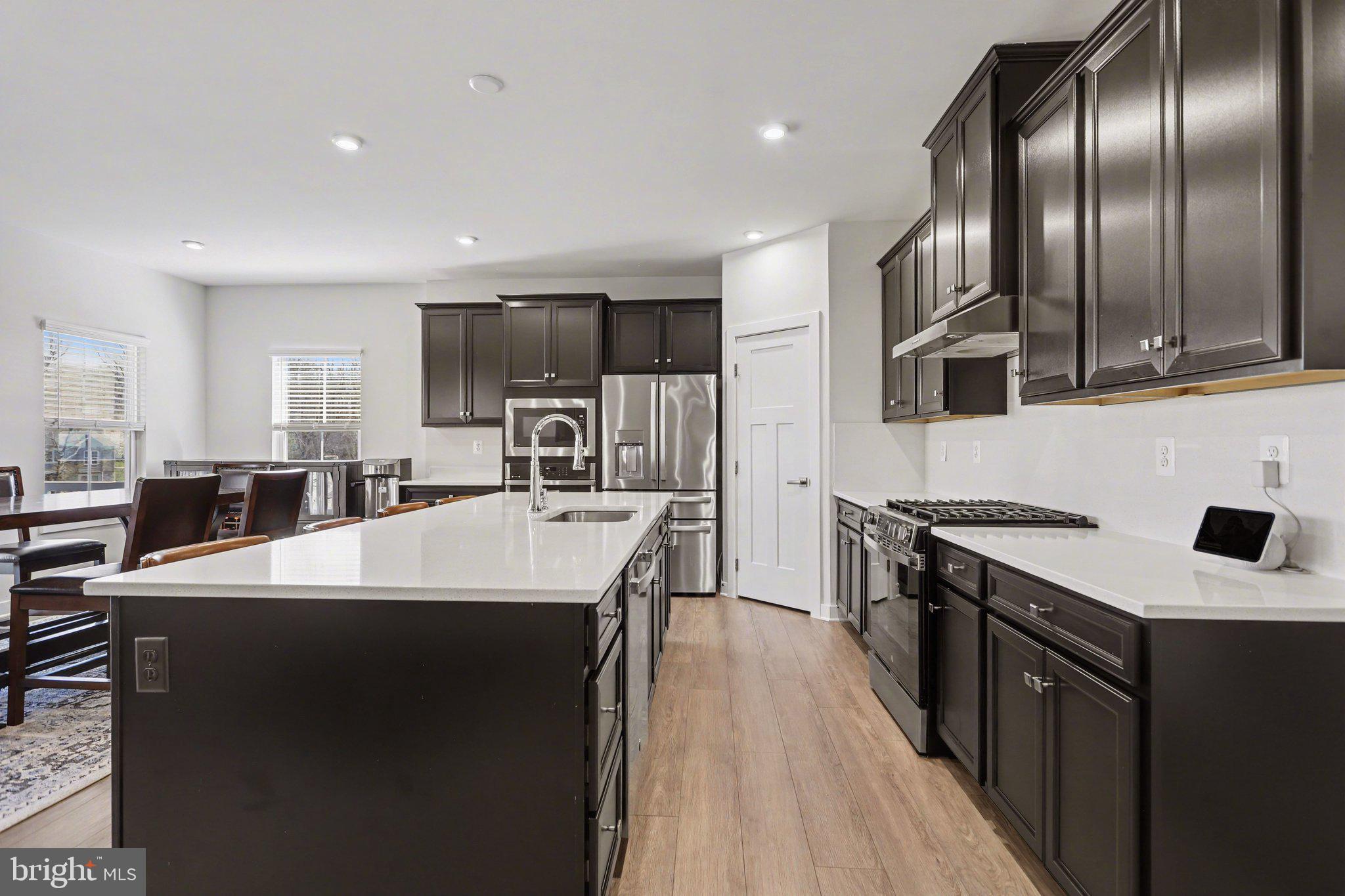 220 Kortney Drive Hanover, PA 17331 - Photo 10 of 41 a large kitchen with stainless steel appliances a sink a stove and a refrigerator